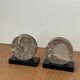 Vintage pair of bookends in fossilised coral agate | Stone disc-shaped bookends on a black marble base
