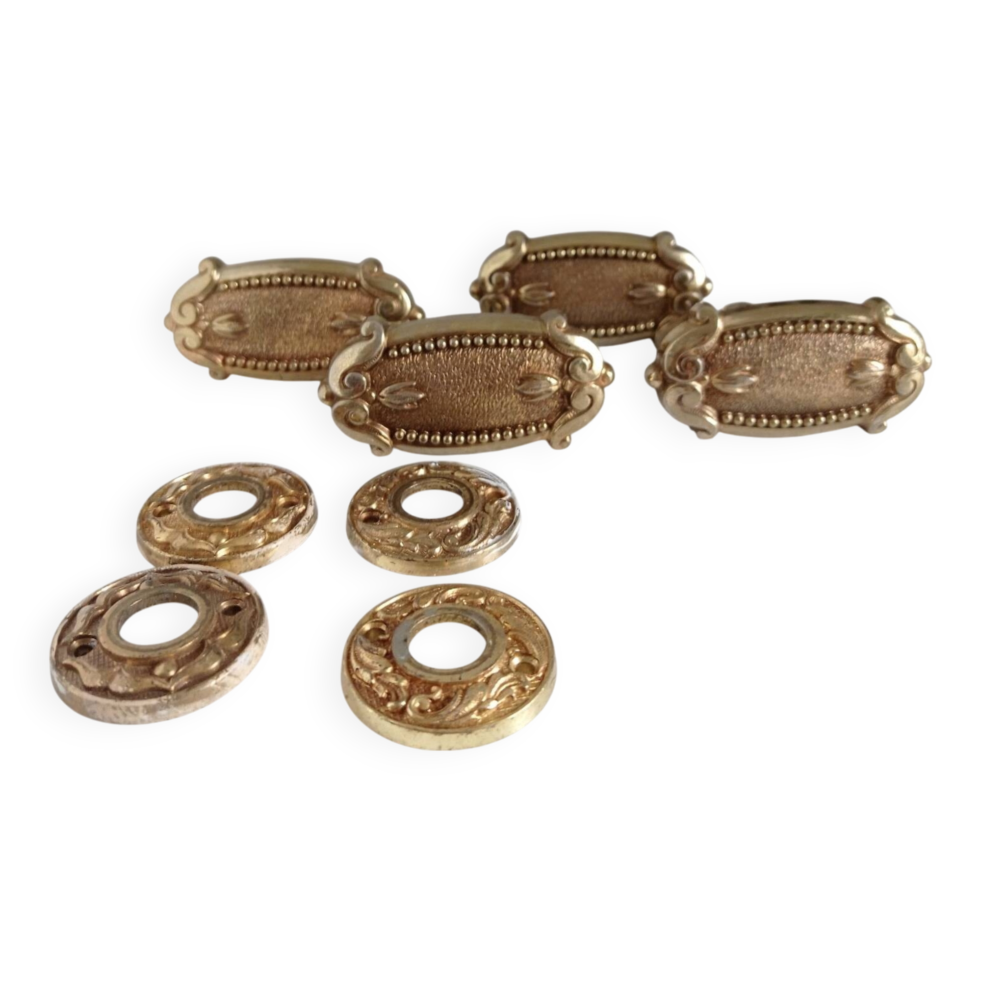 Gold door knobs and rosettes