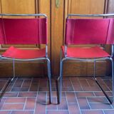 2 tubular chairs in red leather 1970