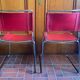 2 tubular chairs in red leather 1970