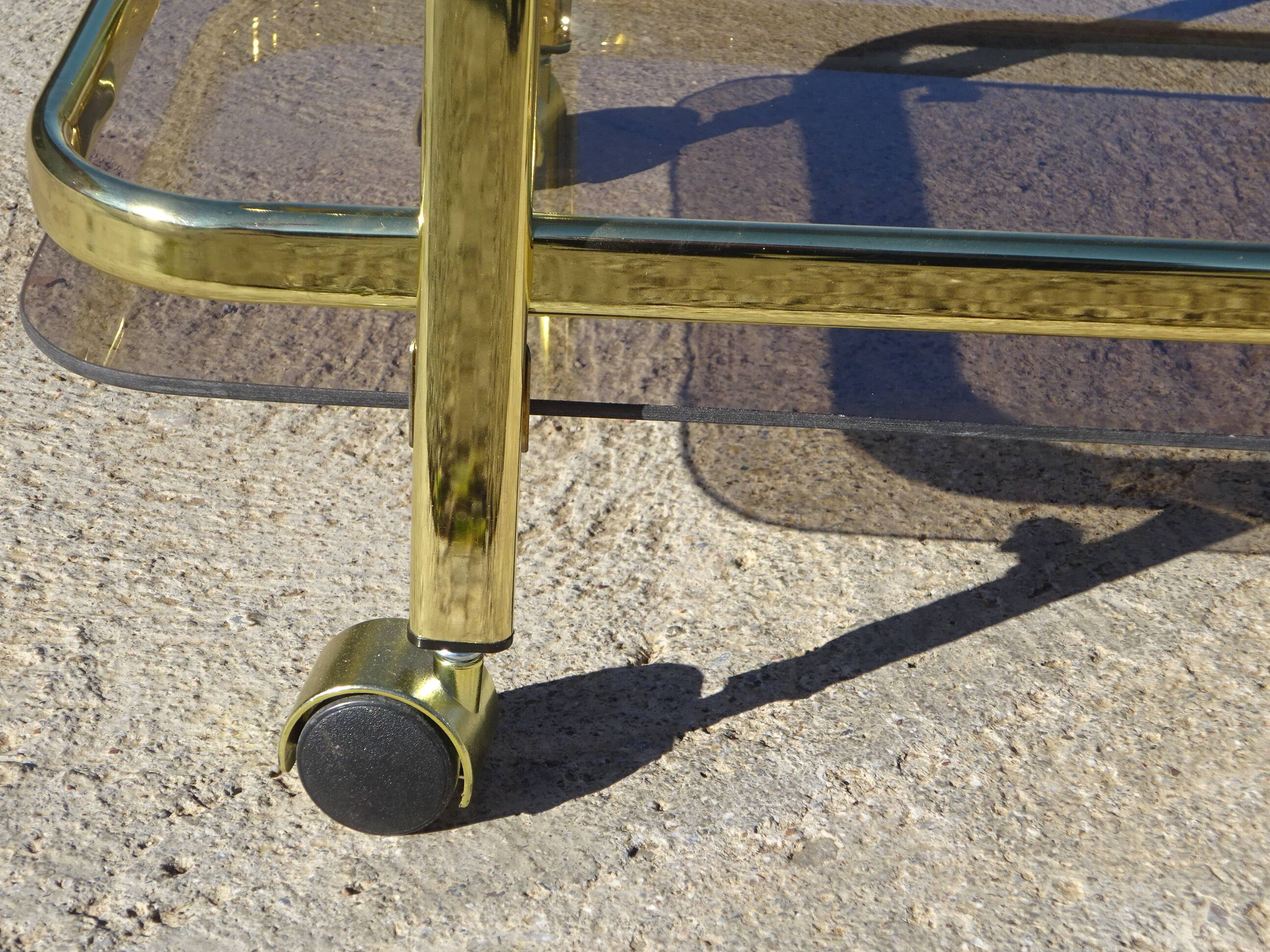 Golden metal and smoked glass dessert table