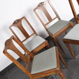 Set of 4 Art Deco chairs in carved wood.