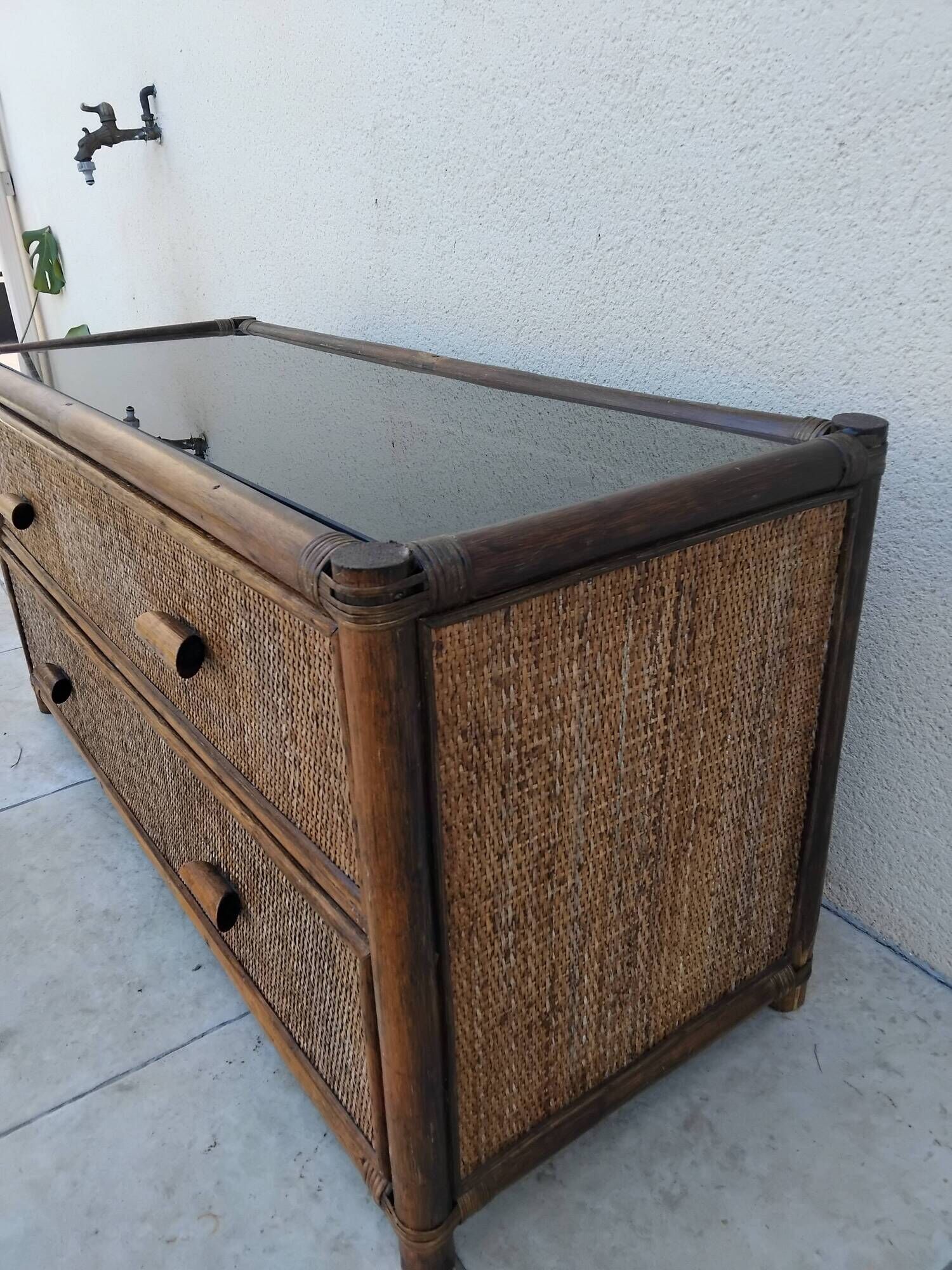 Vintage rattan and glass TV unit.