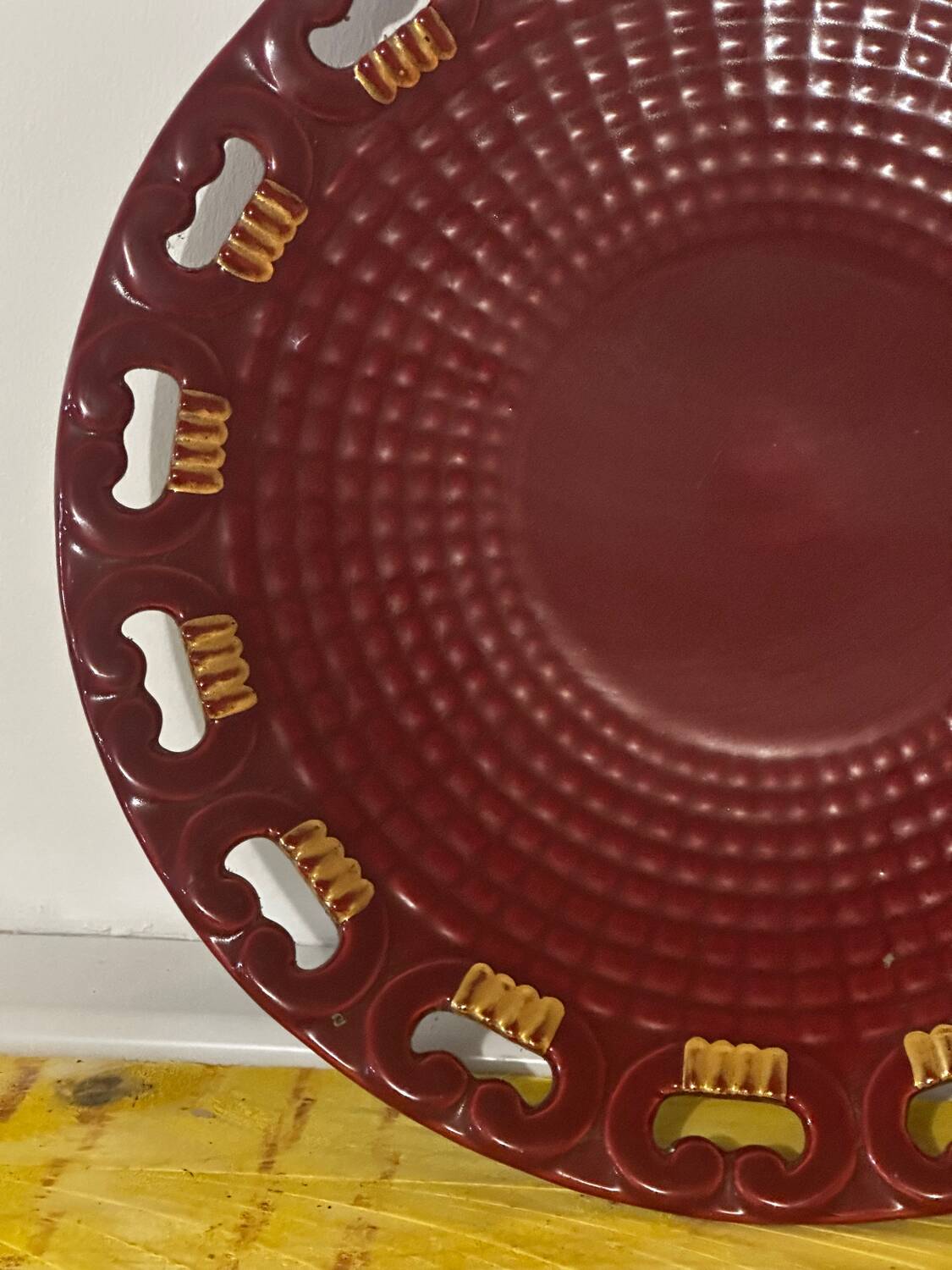Burgundy and gold openwork plate in ceramic from Saint-Clement, 1950s.