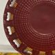 Burgundy and gold openwork plate in ceramic from Saint-Clement, 1950s.