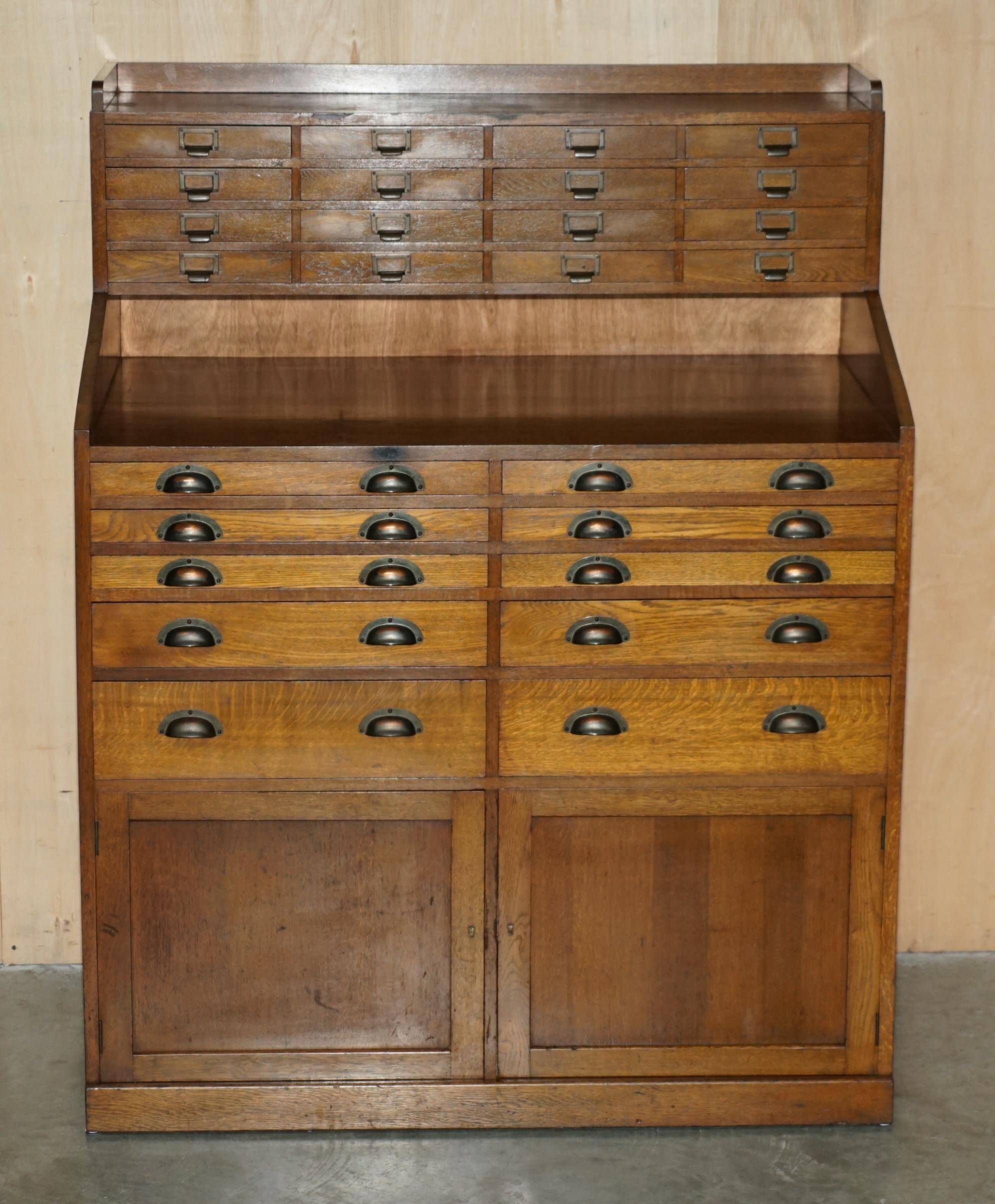 Antique English Art Deco furniture in hand-carved oak, 26 drawers.