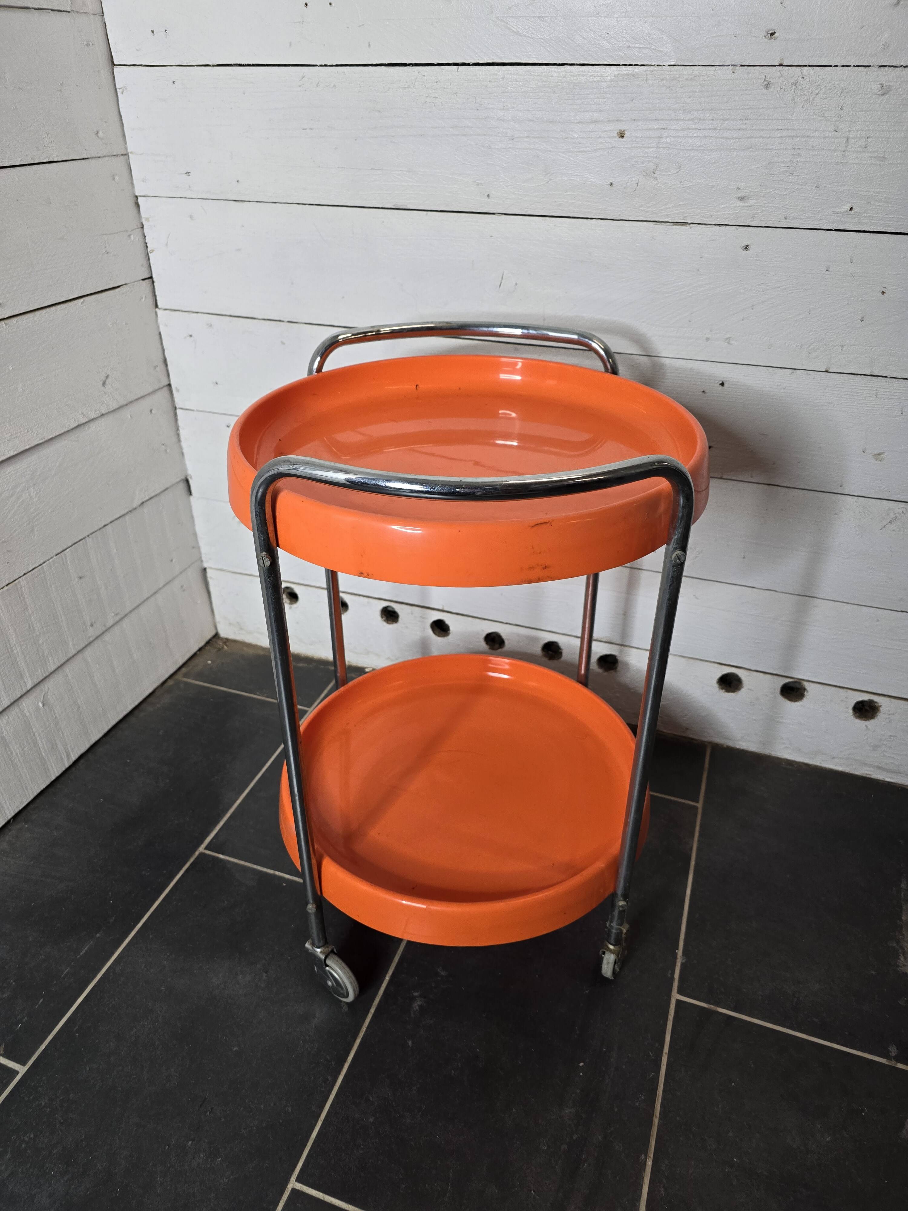 Orange trolley on wheels from the 70s