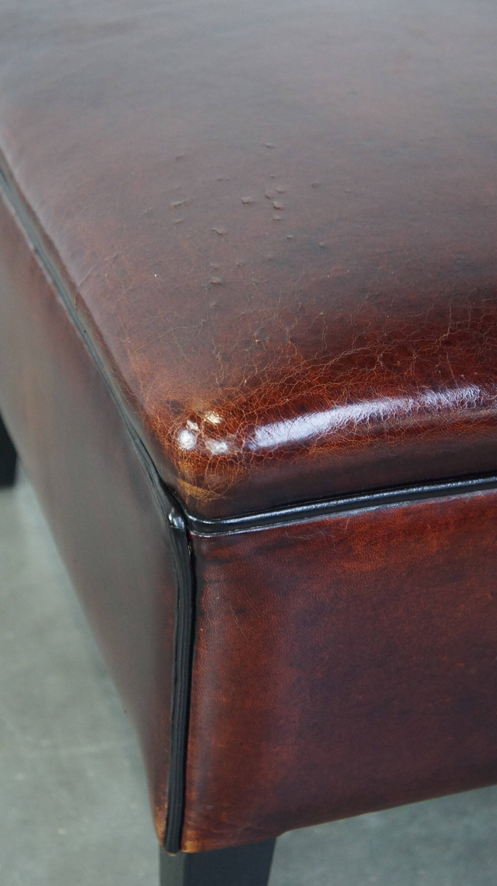 Large square sheepskin leather ottoman with a beautiful patina