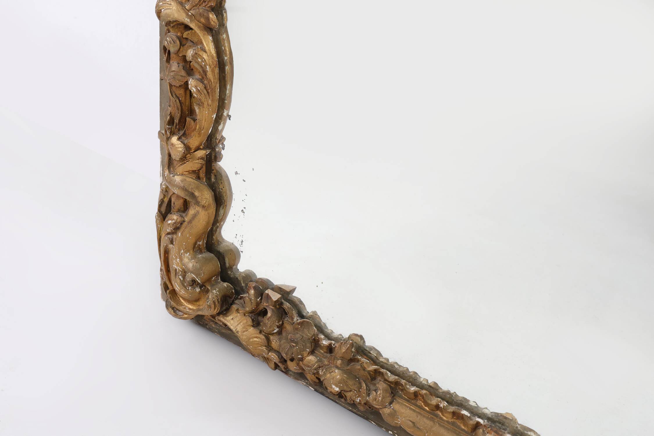 Large baroque decorated chimney mirror in gilted wood, France ca. 1800