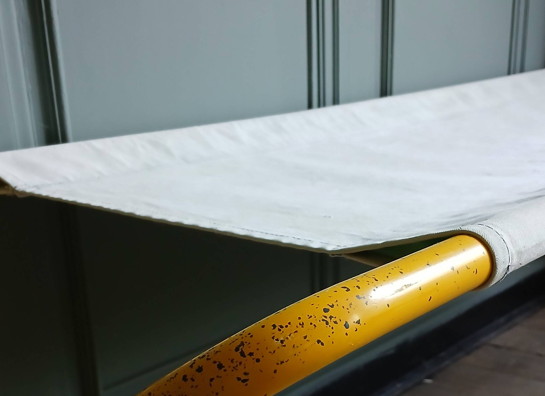 Foldable tube bed in yellow lacquer and denim, around 1970.