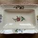 Old dishes in earthenware floral motif