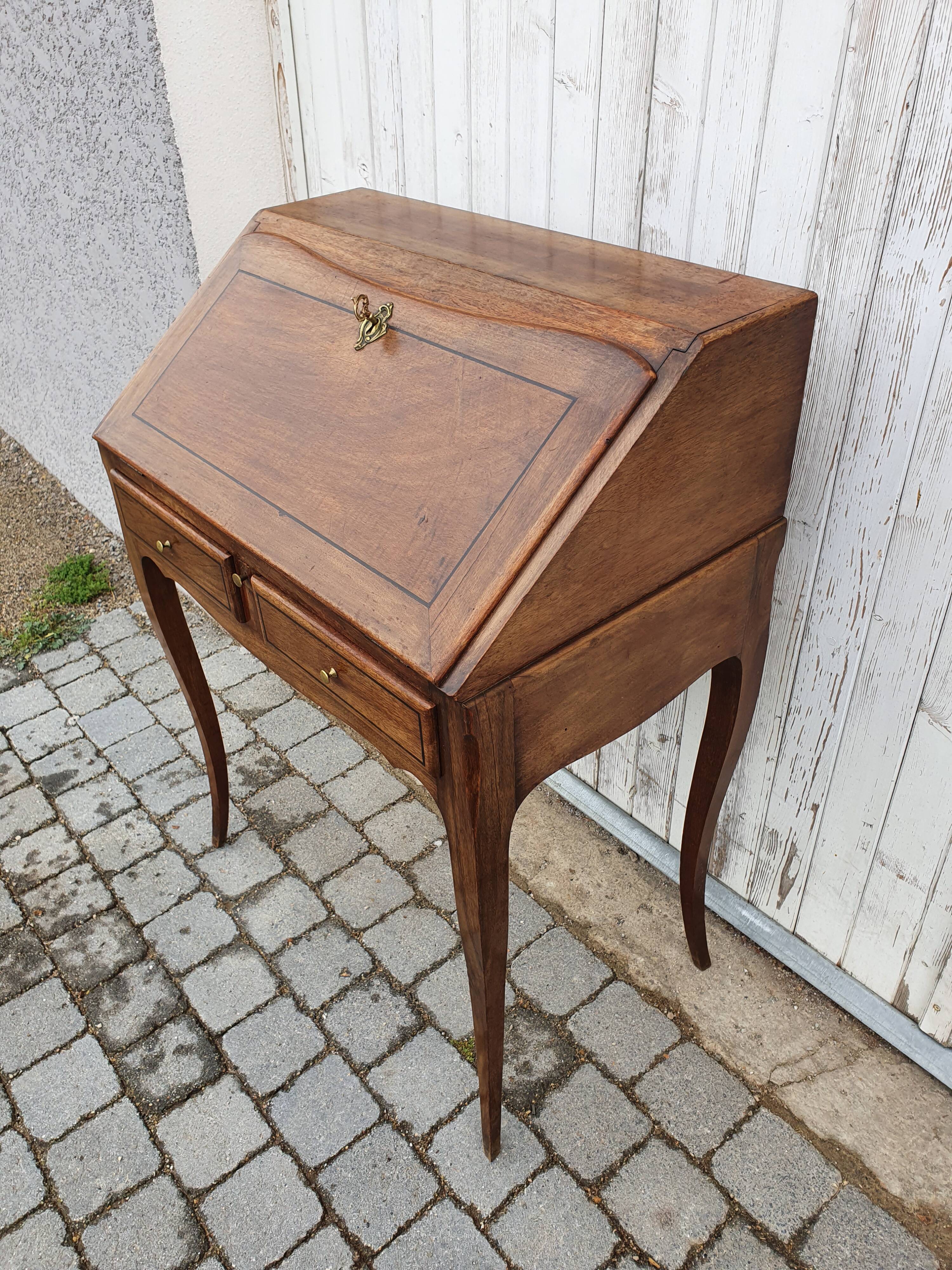 Former small secretary office with a walnut Louis XV