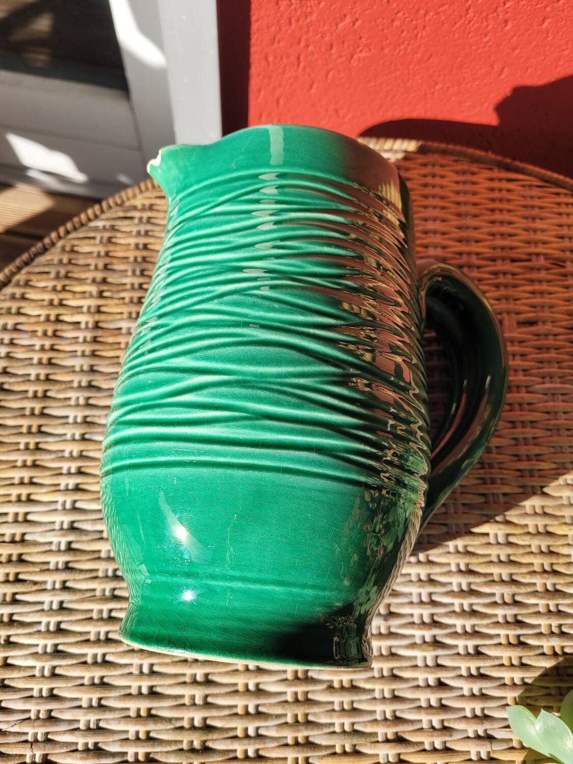 Green glazed ceramic pitcher