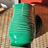 Green glazed ceramic pitcher