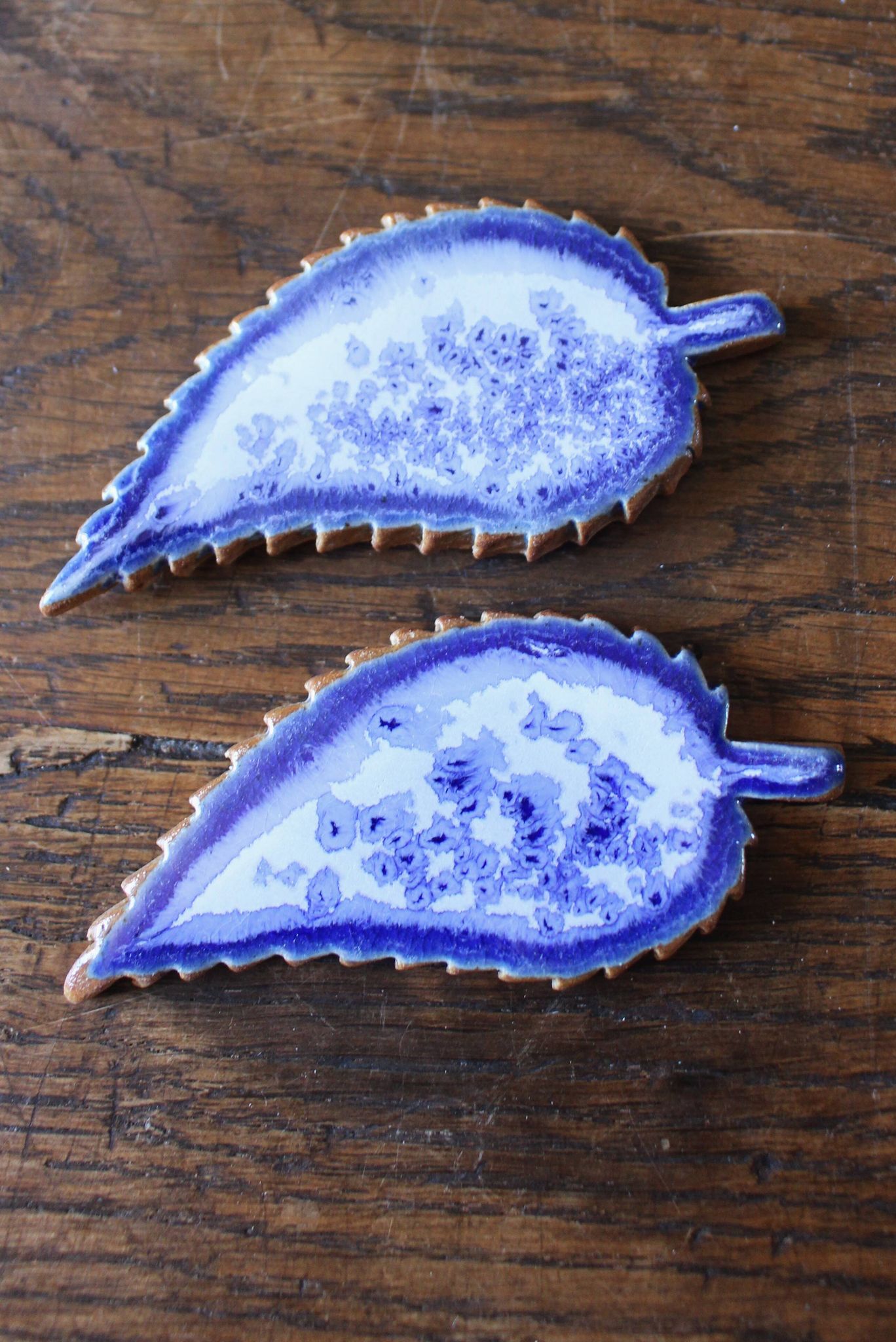 A set of 4 handcrafted pottery knife rests in blue.