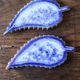 A set of 4 handcrafted pottery knife rests in blue.