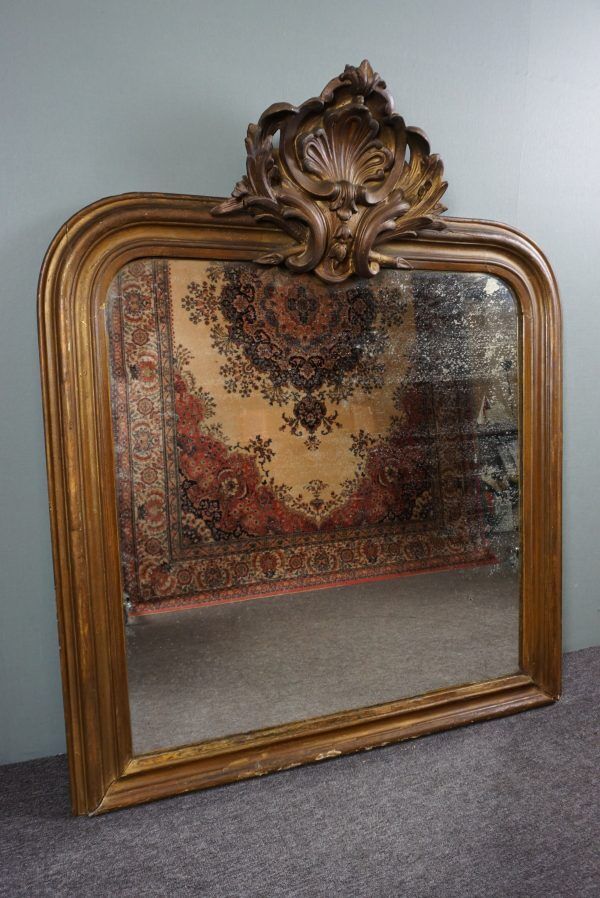 Old French fireplace mirror with beautiful ornament
