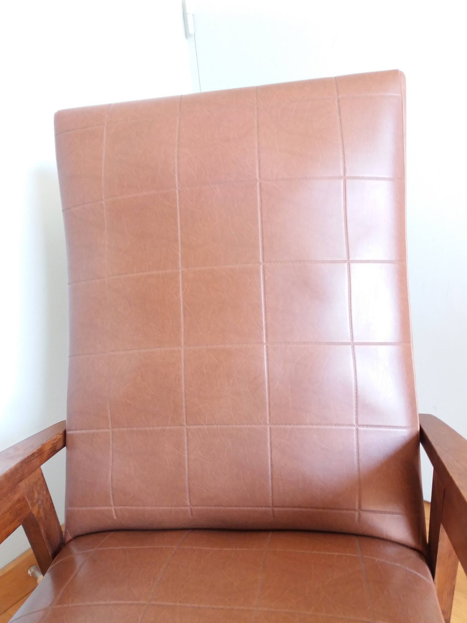 Scandinavian brown skai and wood armchair