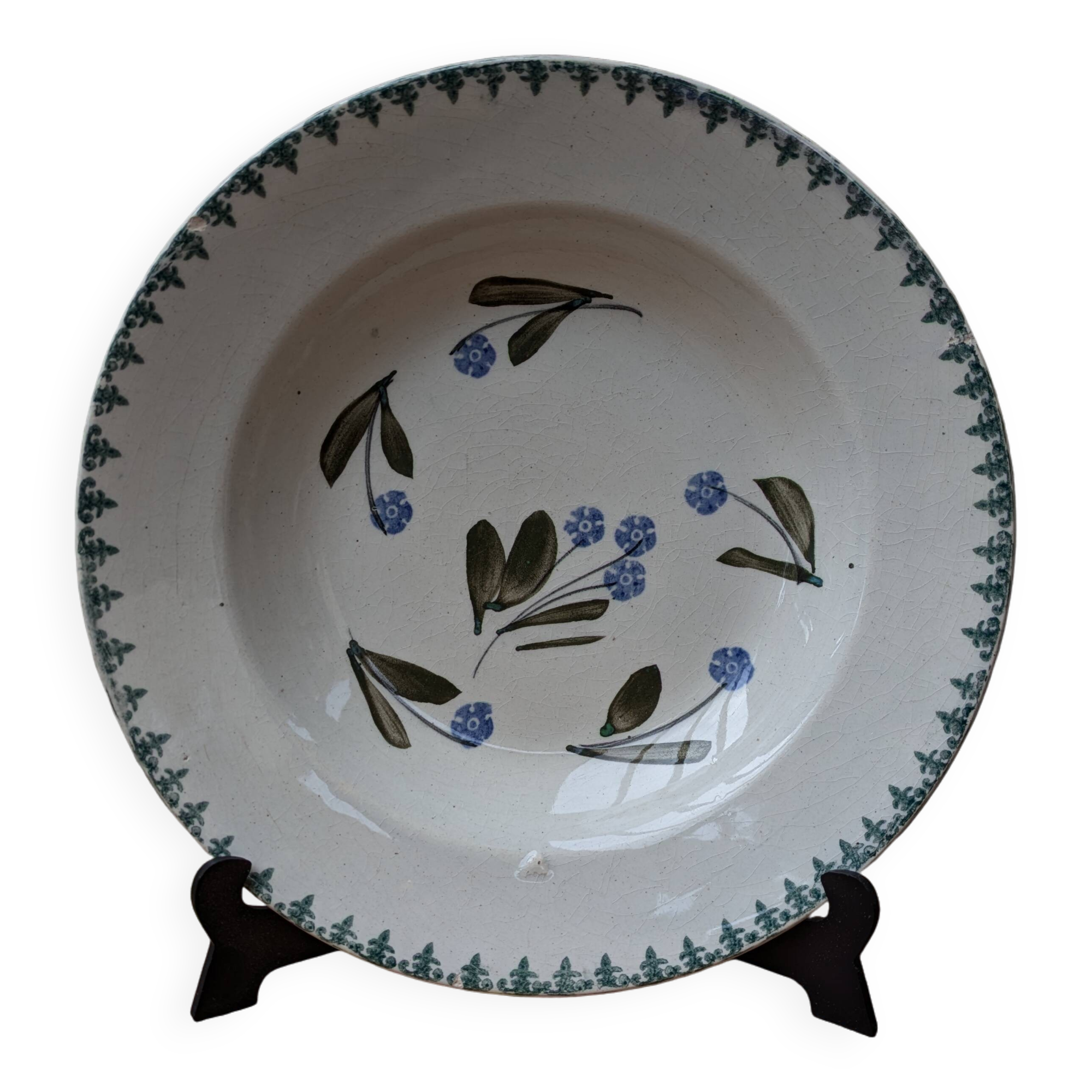 Old deep iron earth plate with blue flower pattern