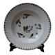 Old deep iron earth plate with blue flower pattern