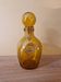 Biot perfume bottle or bubbled glass bottle in amber colour, 1970s design.