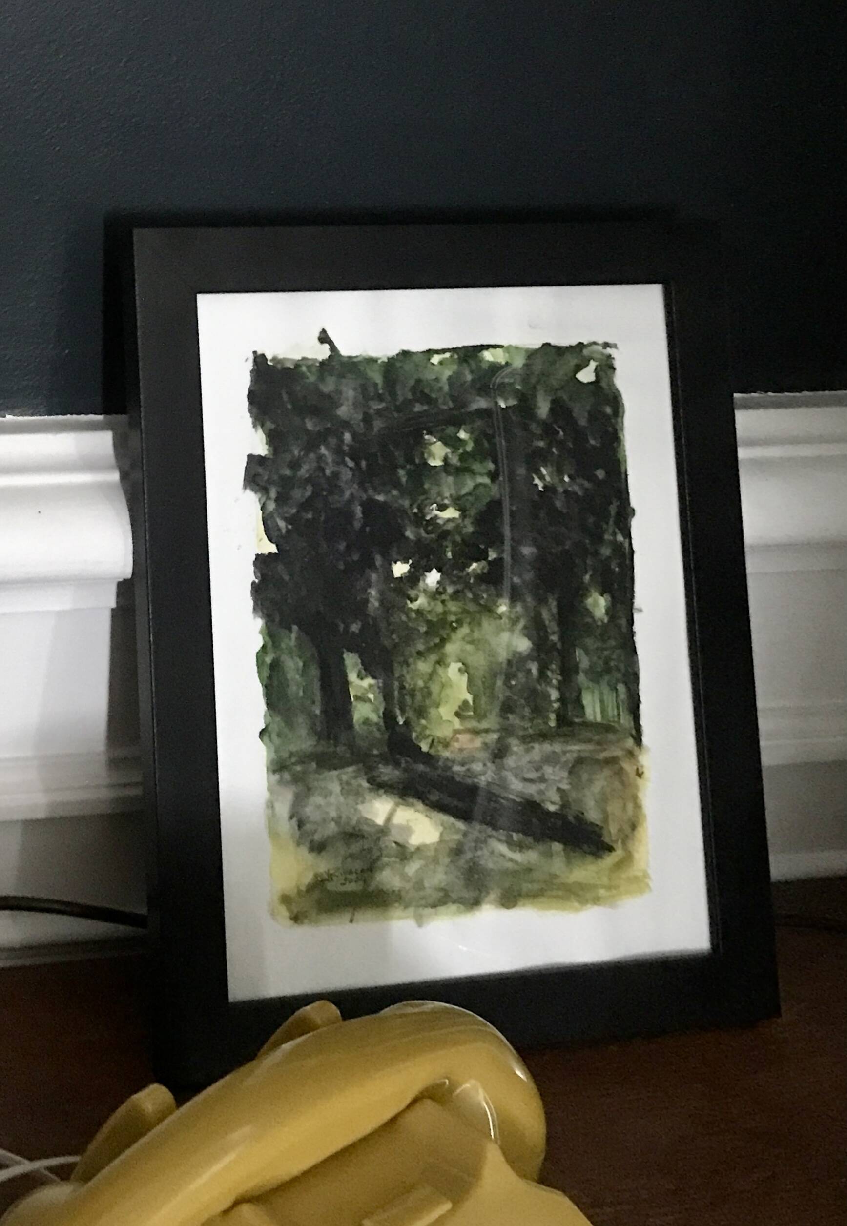 Framed watercolor under wood, signed