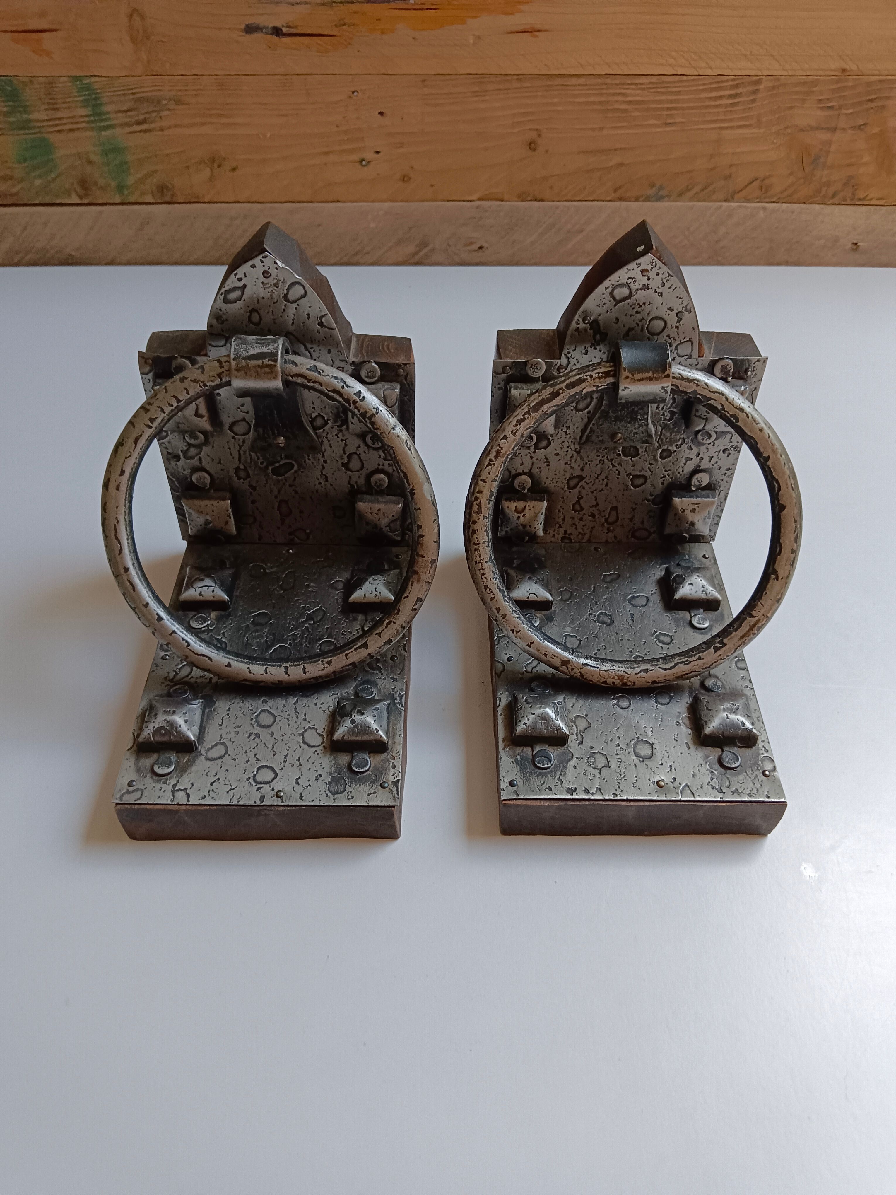 Medieval-style bookends, antique door handle.