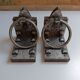 Medieval-style bookends, antique door handle.
