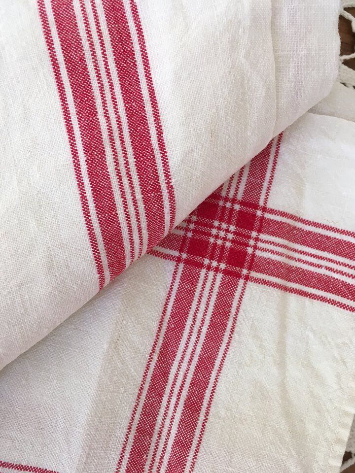 Two mismatched former dishcloths in red and white.