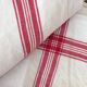 Two mismatched former dishcloths in red and white.
