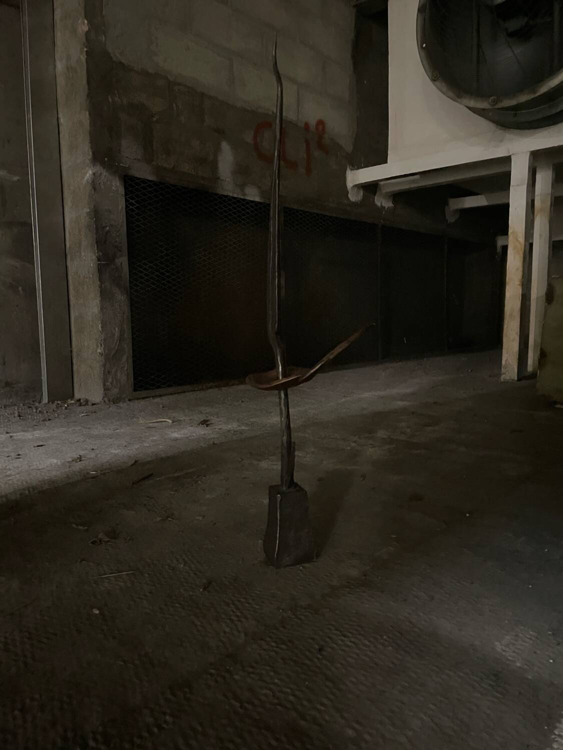 Signed hammered metal and copper sculpture