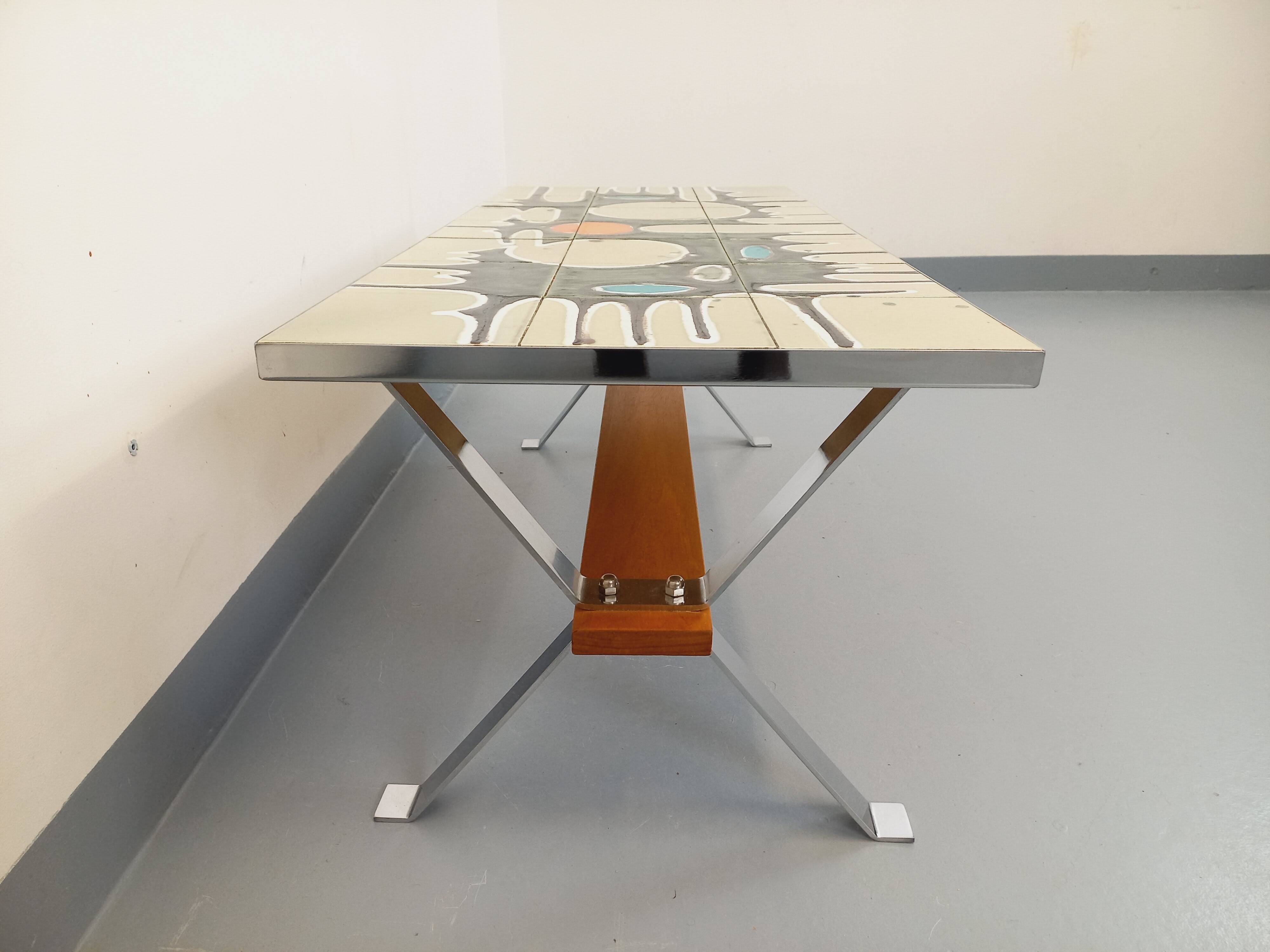 Vintage coffee table from the 60s and 70s in ceramic, chrome metal, and wood.