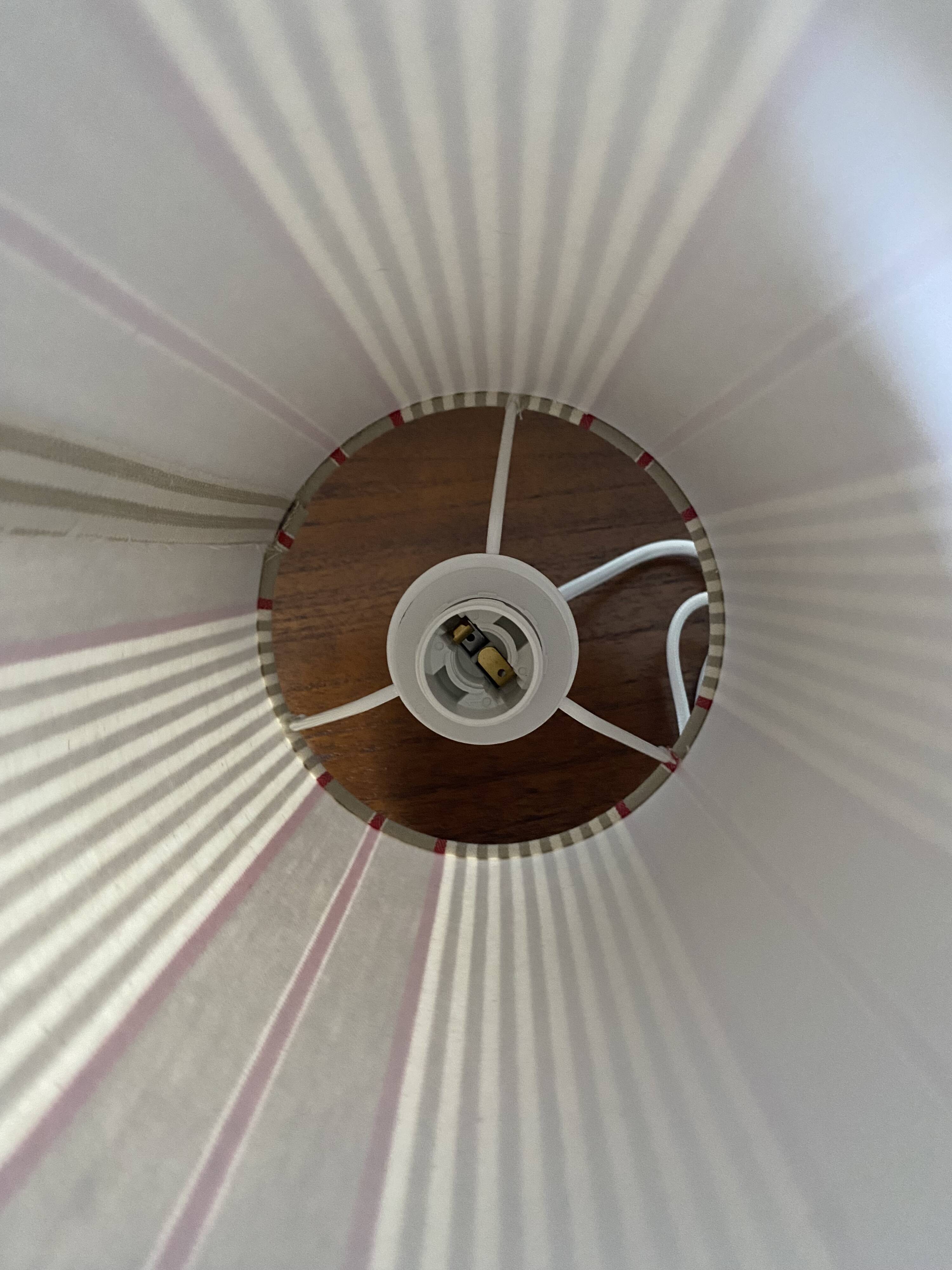 Pair of striped fabric bedside lamps.