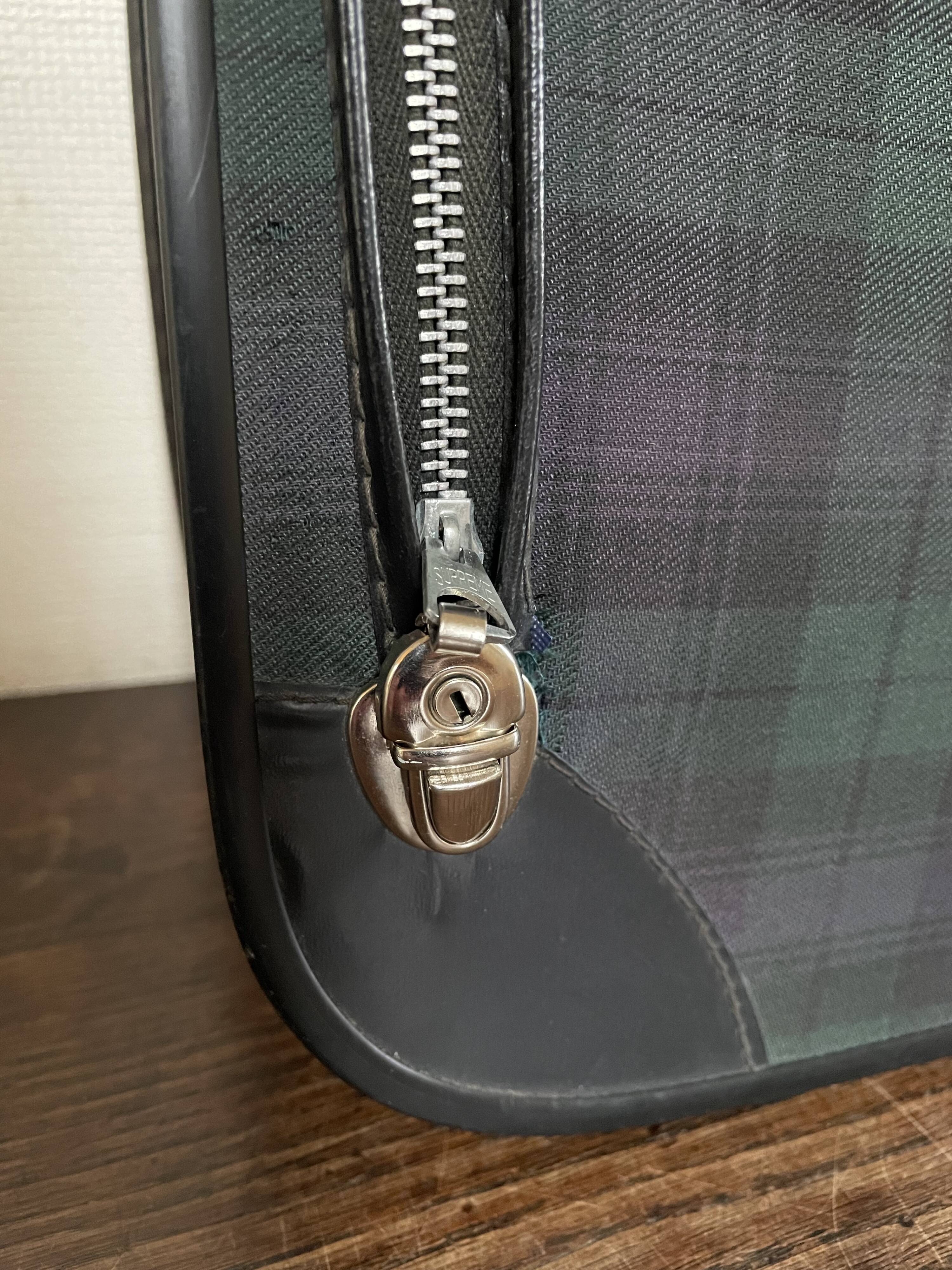 Tartan check suitcase