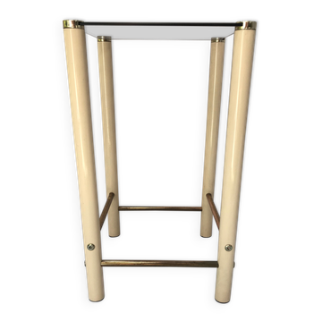 Square side table in metal and smoked glass.