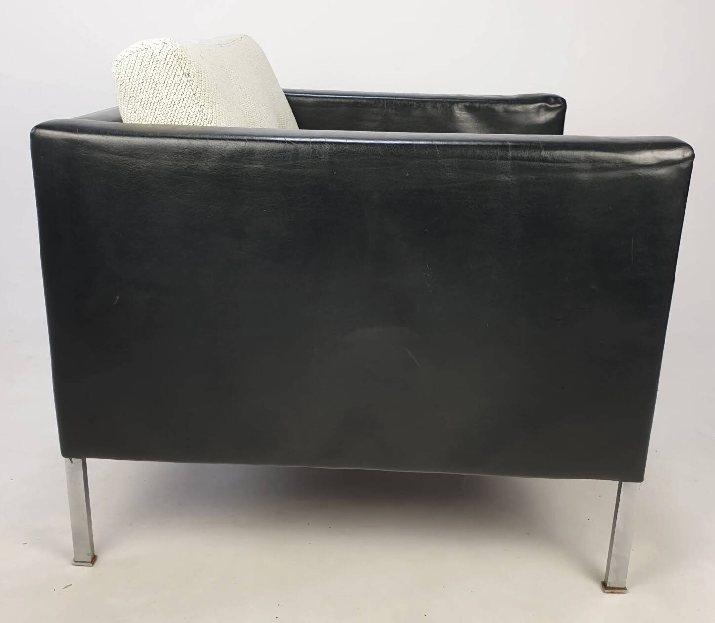Pair of armchairs by Pierre Paulin for Artifort, black leather and cream fabric.