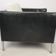 Pair of armchairs by Pierre Paulin for Artifort, black leather and cream fabric.