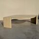 Large designer coffee table in travertine, eye shape, Roche Bobois edition from the 80s