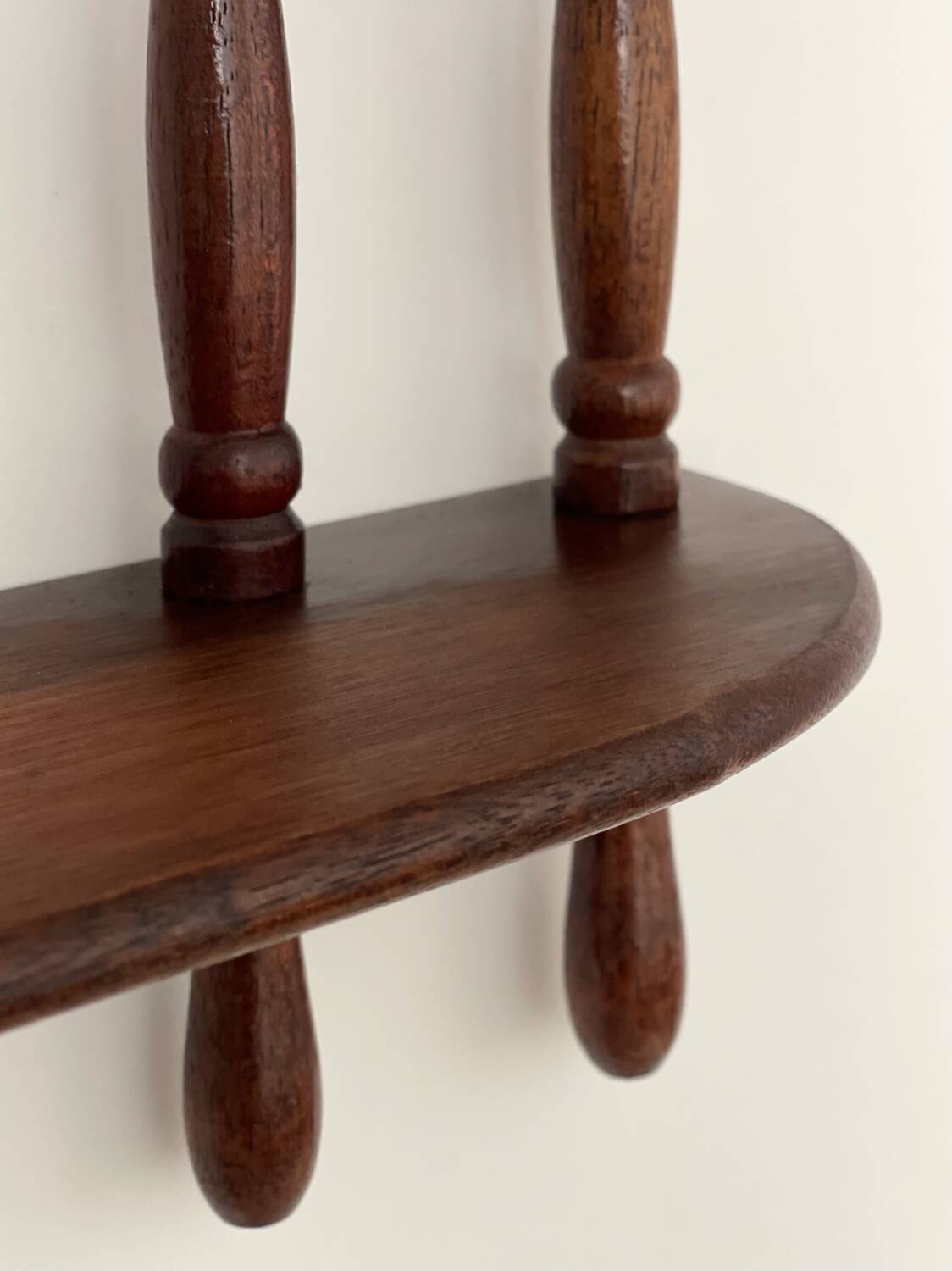 Turned wood wall shelf