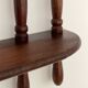 Turned wood wall shelf