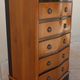 Louis XVI style chest of drawers in wood and cherry veneer.