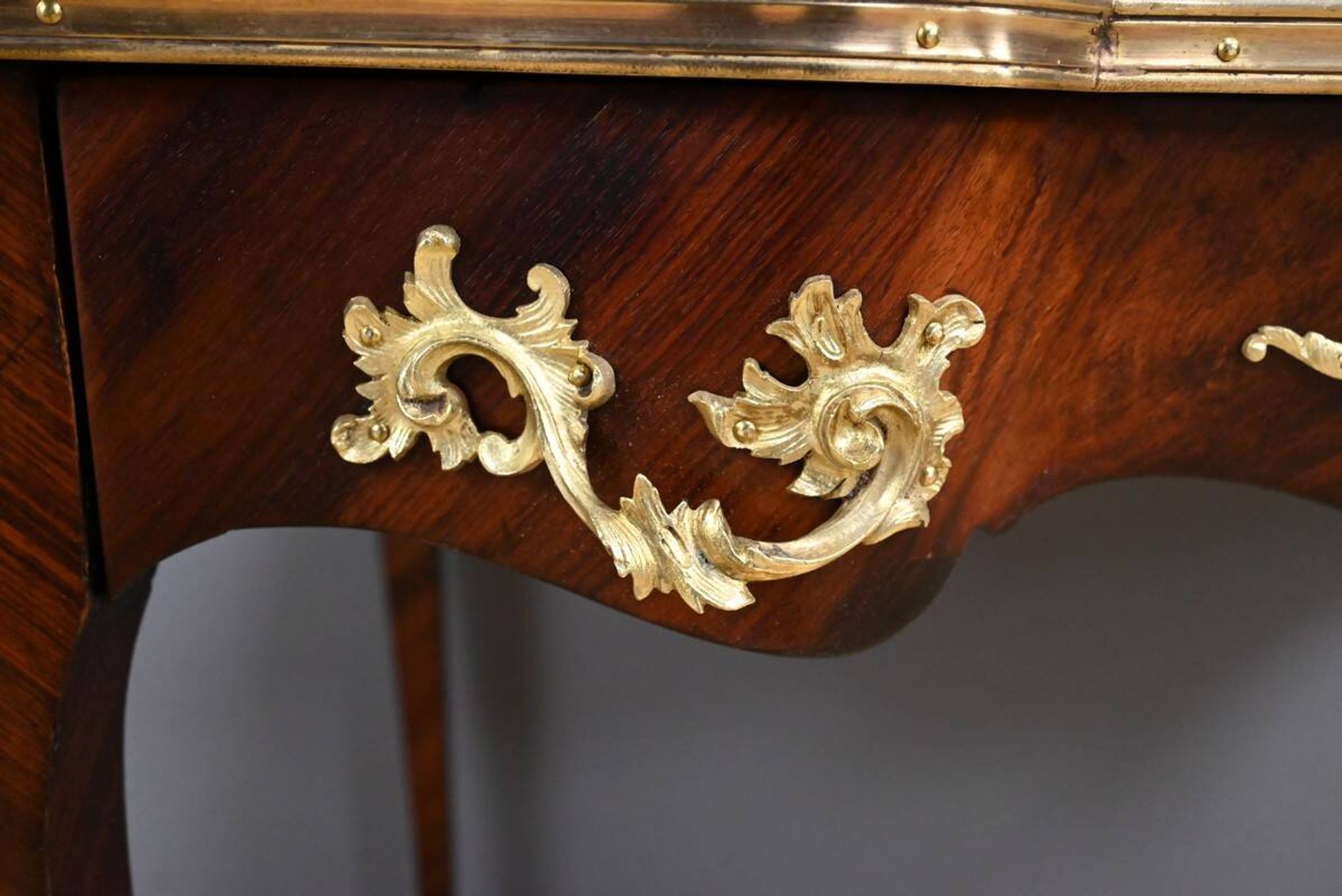 Rosewood, mahogany, and rosewood desk-table, Louis XV style – early 20th century.