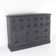 Blackened wooden chest of drawers