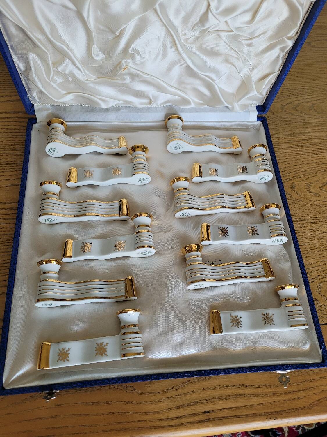 12 Limoges art porcelain knife rests in their case