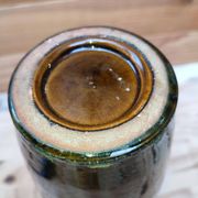 Ceramic vase with dripping in the style of jerome massier or belgian work with bronze handles