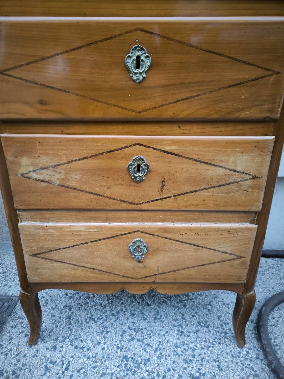 A seven-day chest of drawers in solid cherry wood with ebony stringing, 18th century