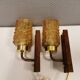 wall lights in rosewood look, with amber coloured glass and brass details.
