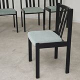Set of 6 modernist black chairs with light blue-green ribbed fabric.