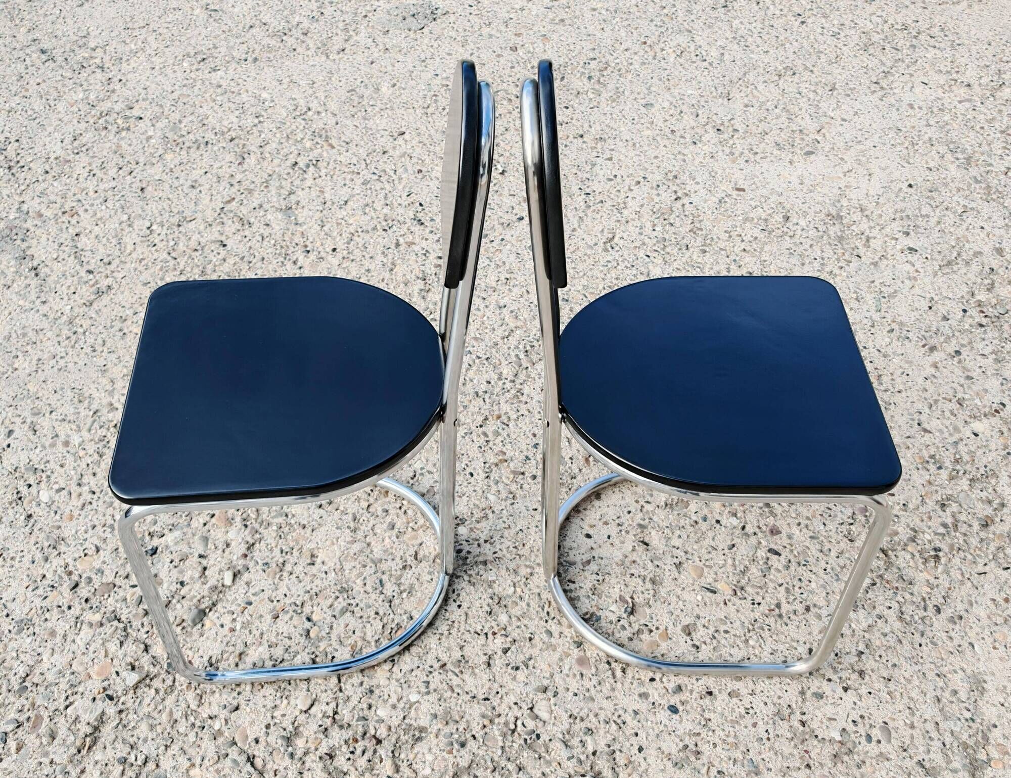 Set of 4 Bauhaus tubular steel chairs with wooden seats.