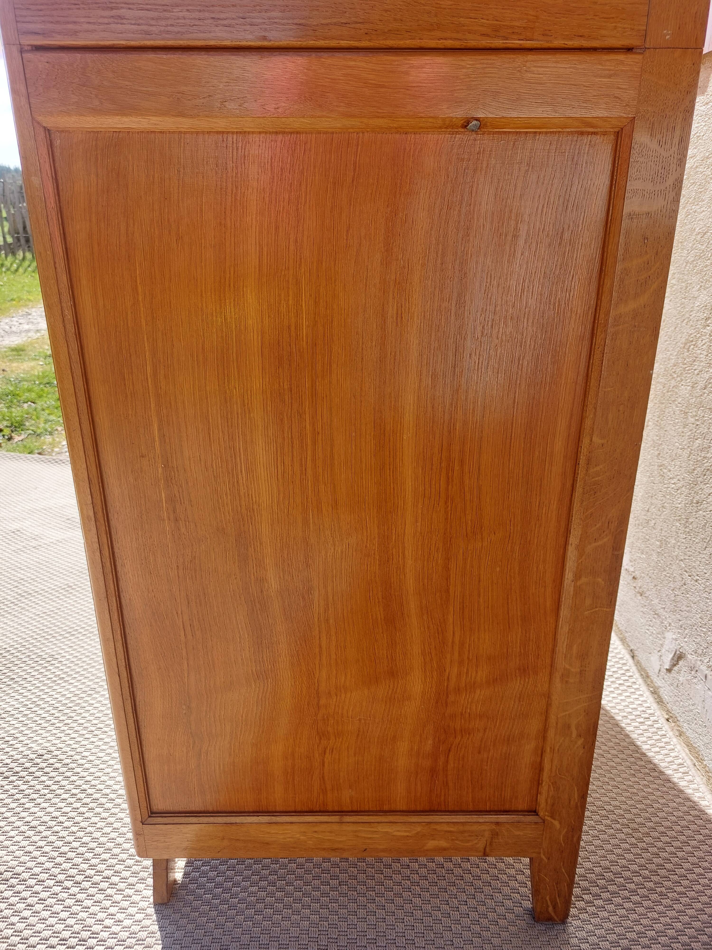 Vintage wardrobe with mirror and tapered legs.